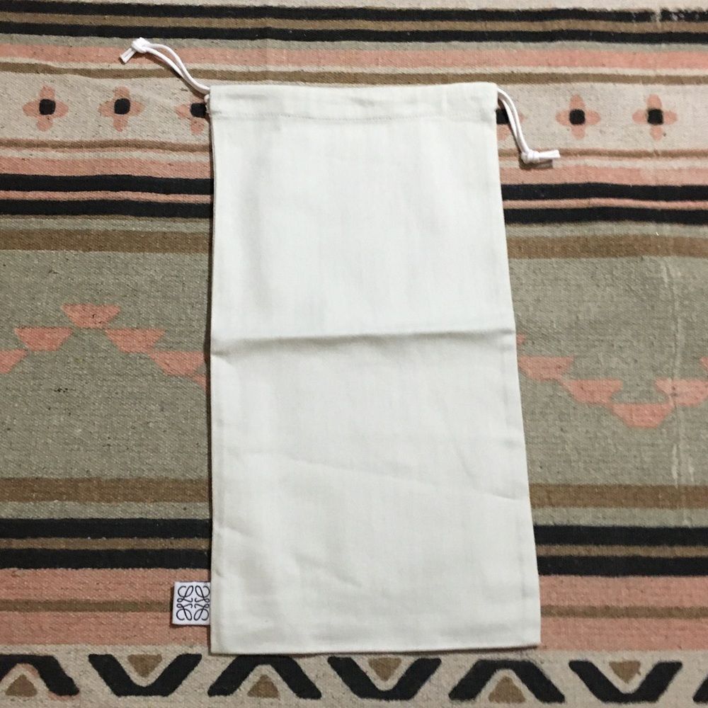 Loewe White Dustbag SMALL approx 14” x 8”
Good for travel 
Never used